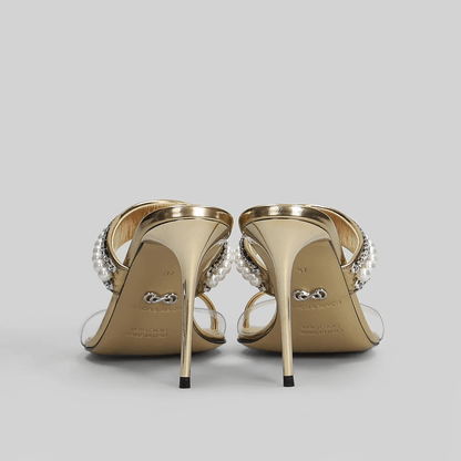 Sandali mule oro cristalli perline tacco 9,5 cm con strap trasparente e dettagli in perline e cristalli.