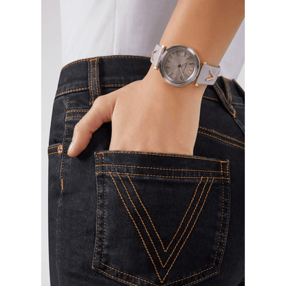 Versace luxury watch 490MNTOROL3D worn on a woman's wrist with jeans, showcasing its elegant design.